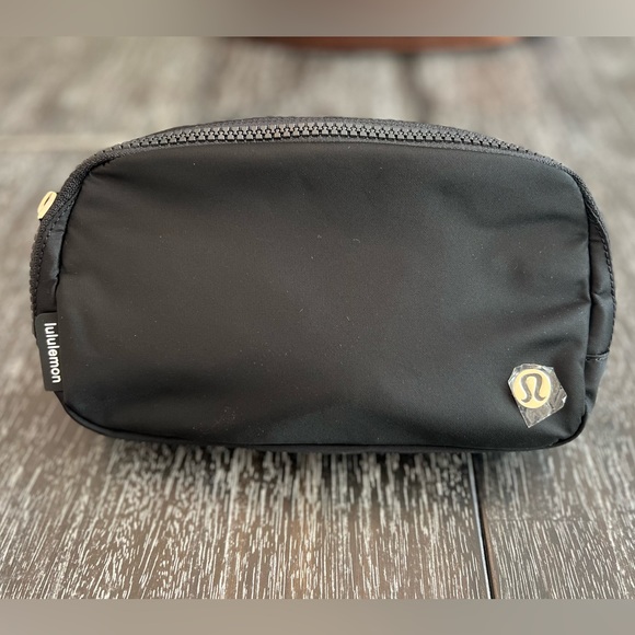 lululemon athletica Handbags - Lululemon Everywhere Belt Bag Black and Gold